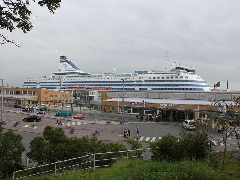 Ferry at a port with vehicles and passengers