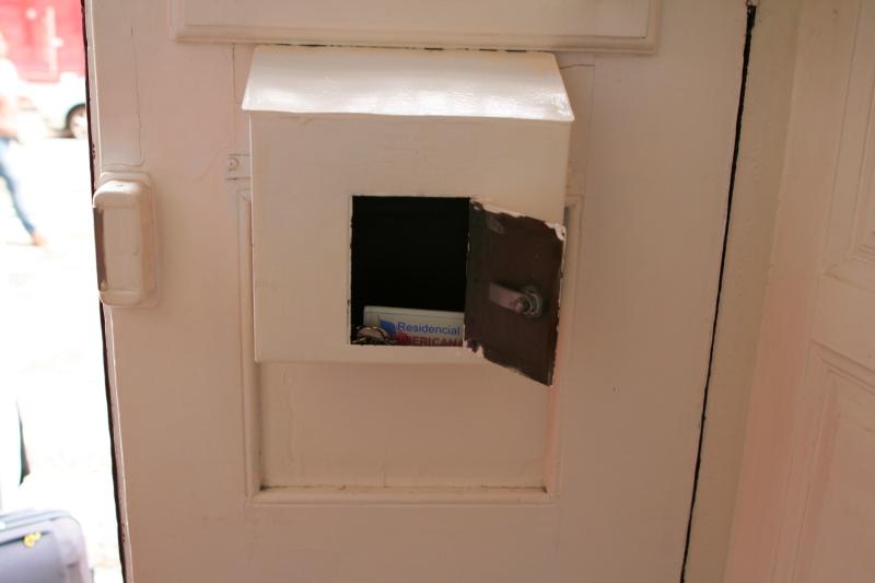 Key in a door mailbox as a symbol image
