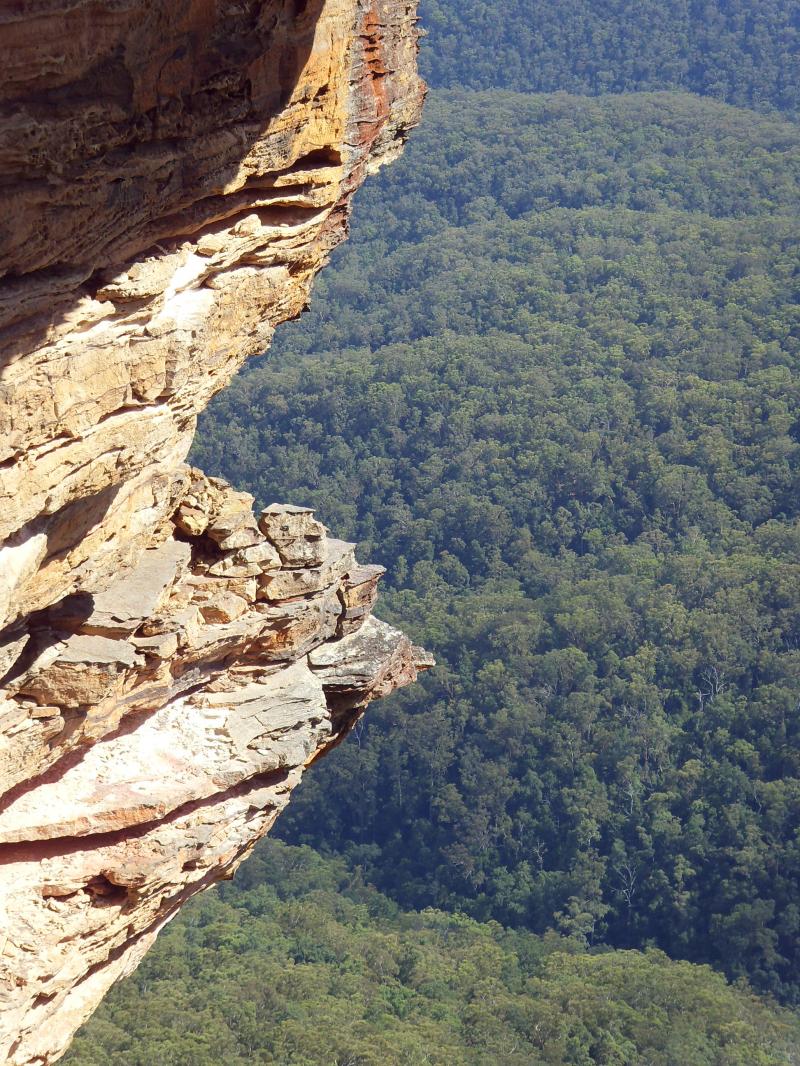 Rock face over a forested valley