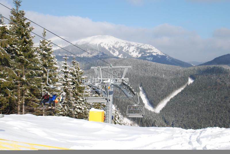 Chairlift over snowy mountain landscape