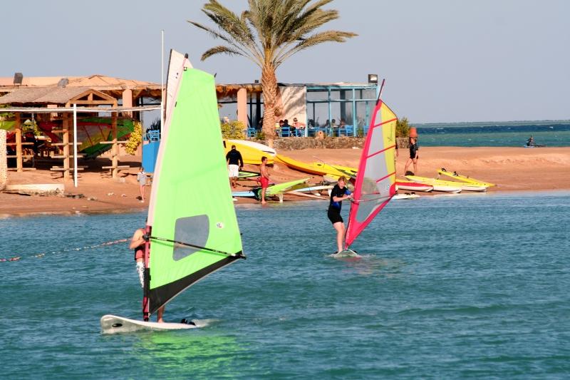 Windsurfers on coastal water
