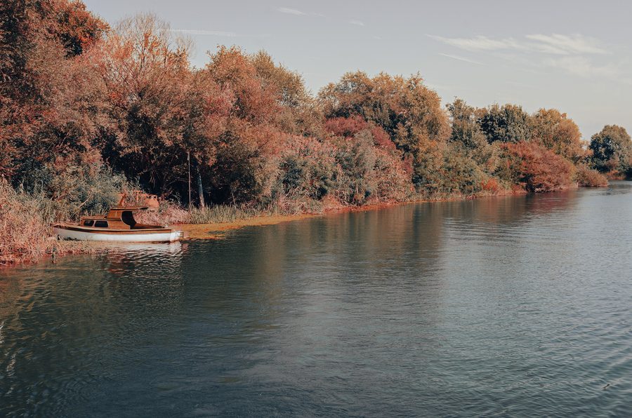 Old boat on the riverbank in Rijeka Crnojevića