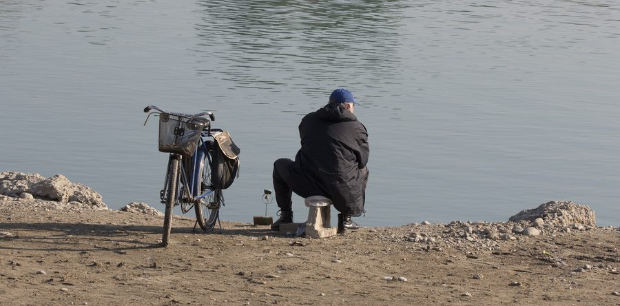 Man fishing on the bank of the Seyhan in Adana