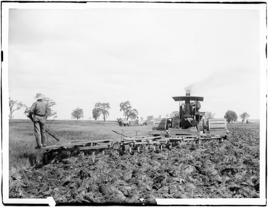 Historic steam plow machine in a field near Hanford in Kings County, California
