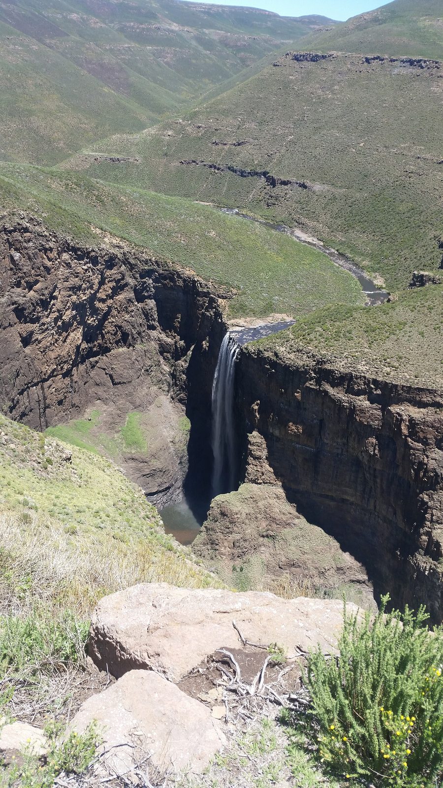 Waterfall in the mountainous landscape of Lesotho