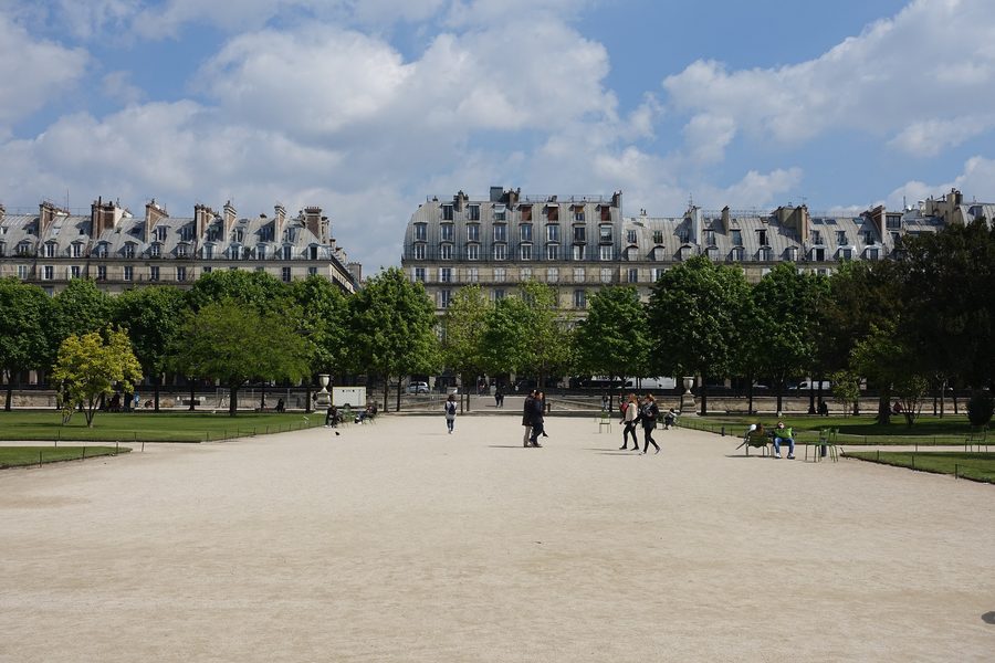 The Jardin des Tuileries in central Paris with trees and a broad formal garden path.