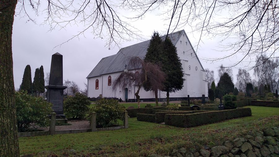 Exterior view of Felsted Church with cemetery in Felsted, Denmark