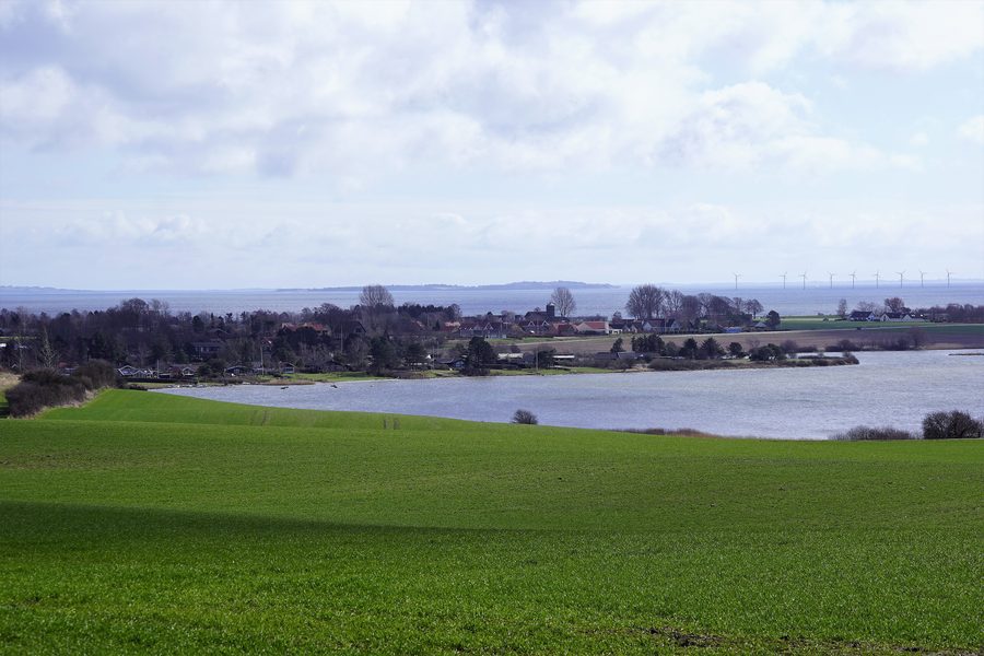 Norsminde seen from the northwest with coastal landscape and fjord