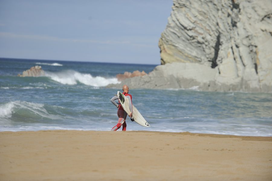 Surfer on a beach in Sopelana