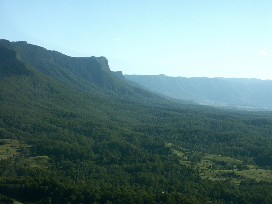 Aerial view of the upper Tweed Valley with wooded slopes and rural scenery in New South Wales