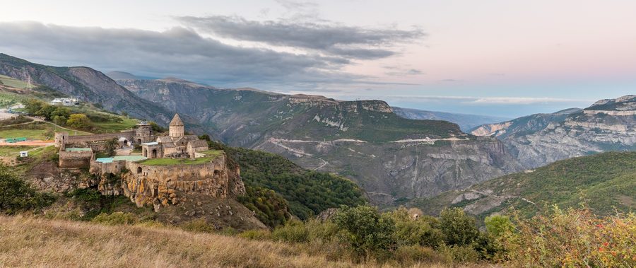 Tatev Monastery on a high plateau above the Vorotan Gorge at sunset