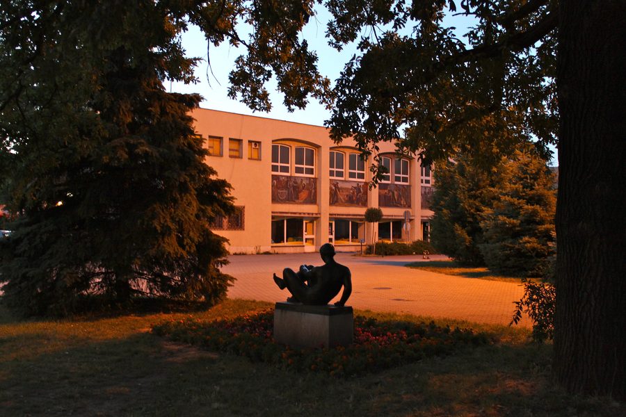 Shopping mall and statue at night, Bartók