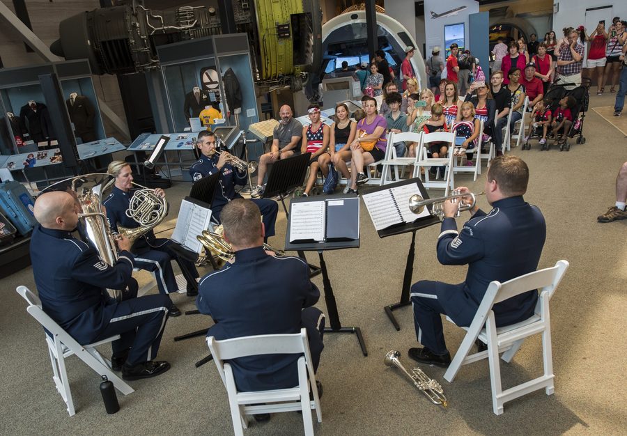 A brass quintet performing at the Smithsonian's Air and Space Museum in Washington, D.C.