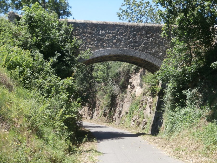 Stone arch bridge over the Via Fluvia