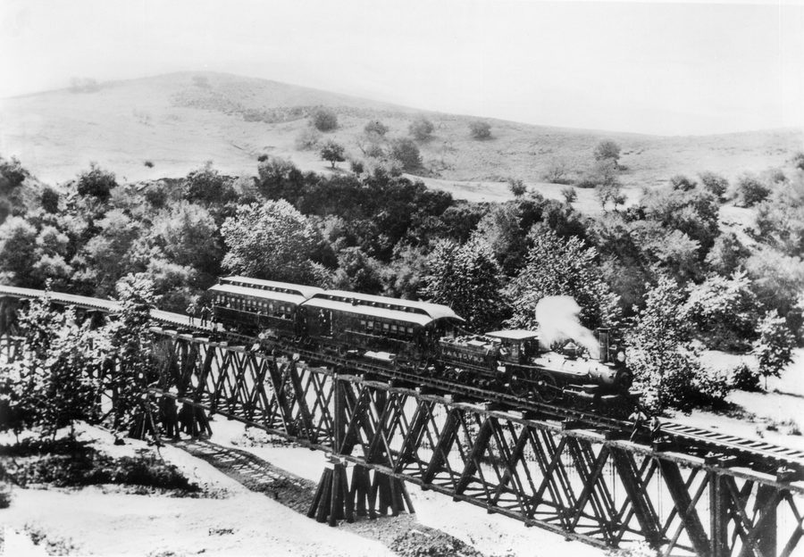 Los Angeles and San Gabriel Railroad train on the bridge at Garvanza, the first trestle across the Arroyo Seco, approaching Highland Park from South Pasadena, circa 1885