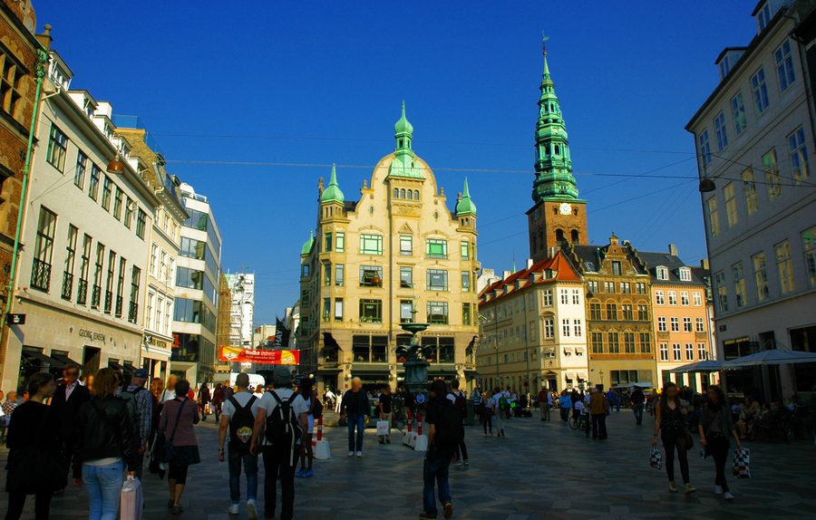 People walking along the Strøget pedestrian street in Copenhagen