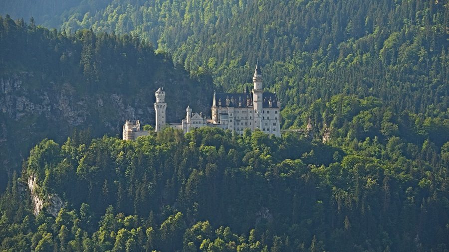 Neuschwanstein Castle near Schwangau in front of the Bavarian mountain landscape