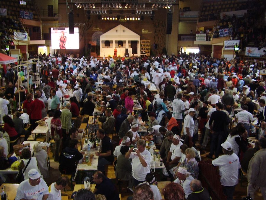 People making sausage at the Csabai Kolbászfesztivál in Békéscsaba.