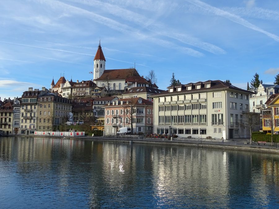 View of Thun with the historic town, Lake Thun and mountains in the background
