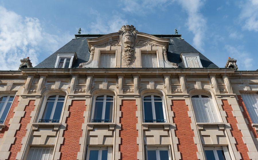 Upper part of the facade at 15 place du Palais in Thiers, Puy-de-Dôme, France