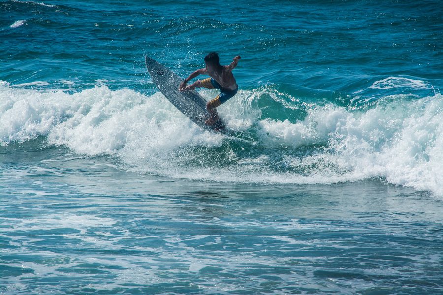 Surfer on the coast of northern Luzon