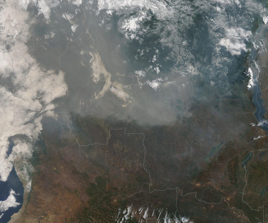 Satellite image of fires in Central Africa with smoke and burned areas.