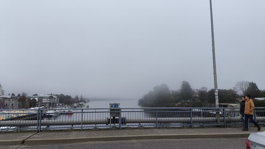 Pedro de Valdivia Bridge over the river in Valdivia, Chile, with fog over the water