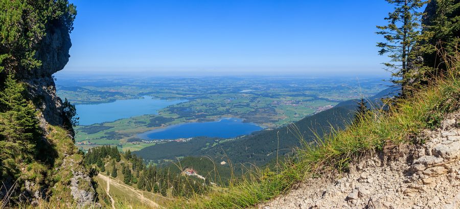 View from Tegelberg across Lake Forggensee and Bannwaldsee toward the landscape of Ostallgäu