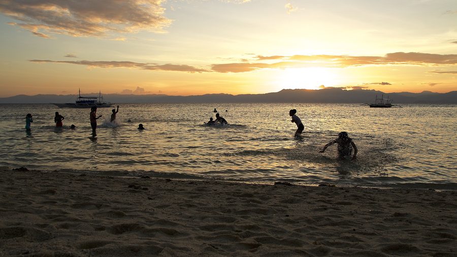 Children playing at Panagsama Beach in Moalboal on Cebu