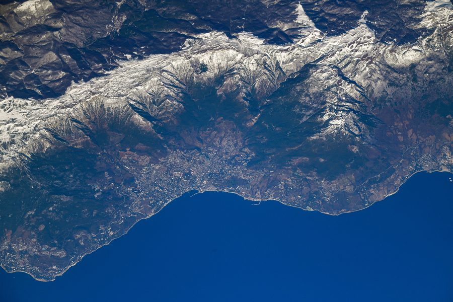 Yalta on Crimea’s south coast with the Crimean Mountains behind it, seen from space.
