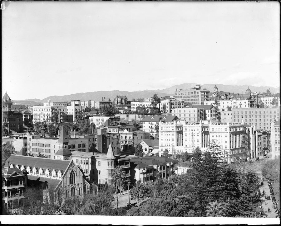 Panoramic view of Los Angeles with dense development and hills in the distance.