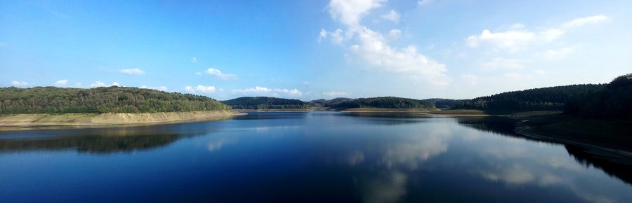 Panorama of the Great Dhünn Dam with wooded slopes