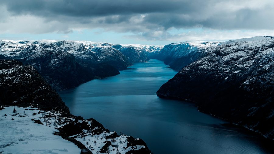 Norwegian fjord Lysefjord with steep rock cliffs and water