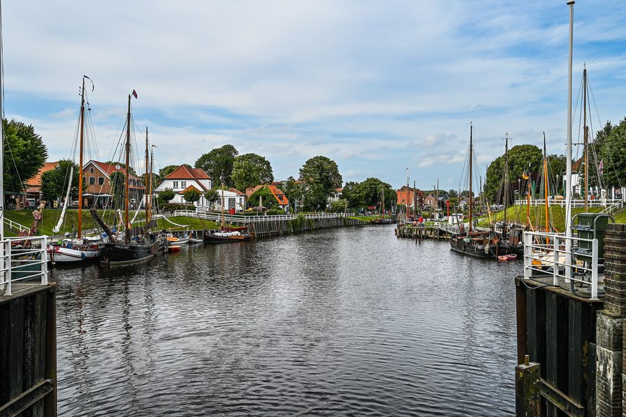 Historic museum harbor in Carolinensiel with traditional boats