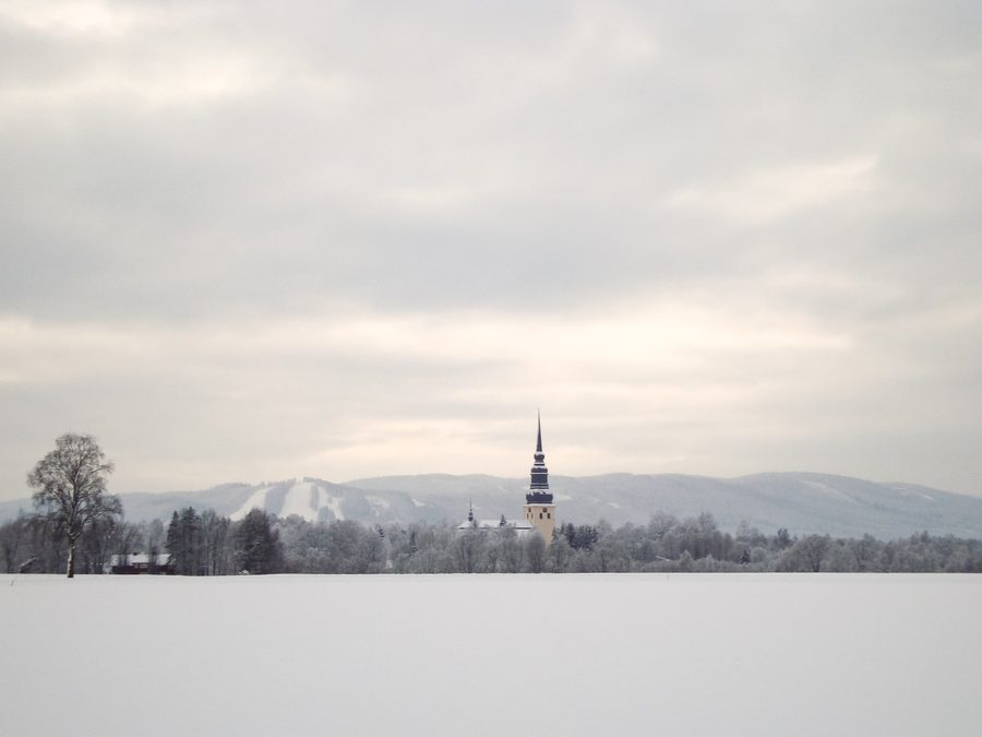 Nybroberget with ski slopes and the church of Stora Tuna, Borlänge