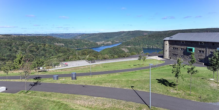 Building of the former Ordensburg Vogelsang in the Eifel National Park with the Urft reservoir in the background