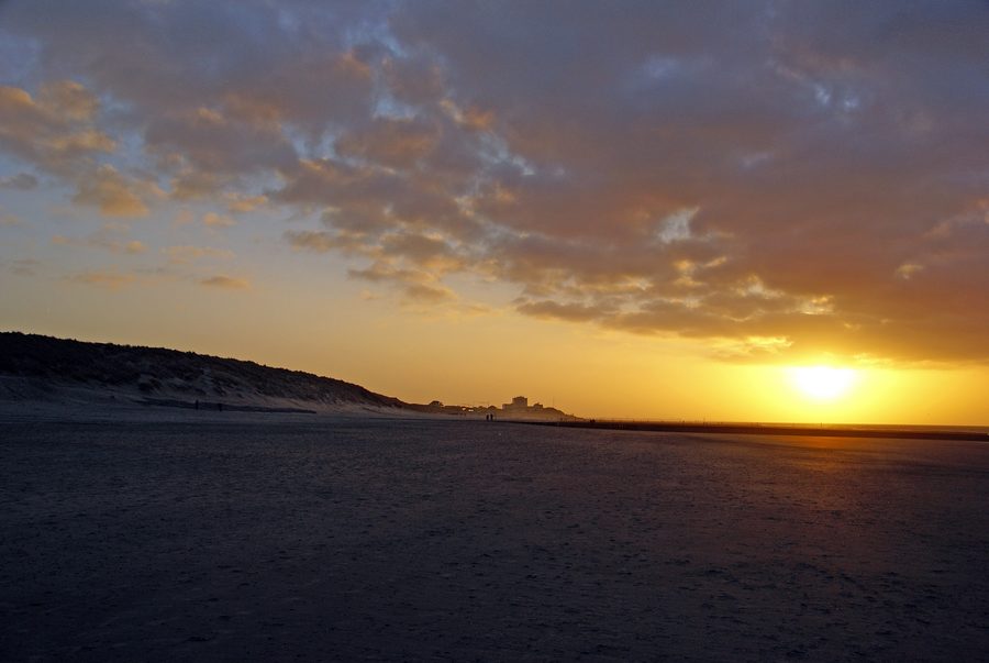 View from the beach to the town of Norderney in the evening