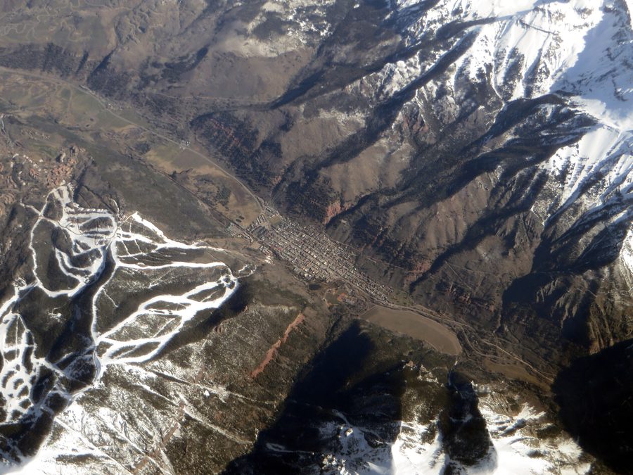 Telluride in a canyon, surrounded by forested mountains and steep rock walls