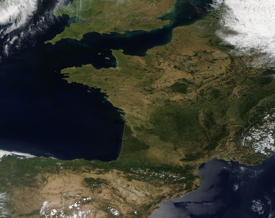 Satellite image of Western Europe with clear summer conditions and little cloud cover.