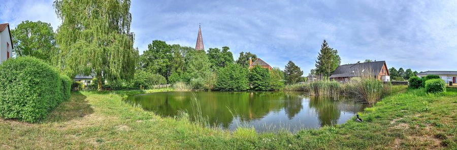 Village pond in Spornitz with a view of the church