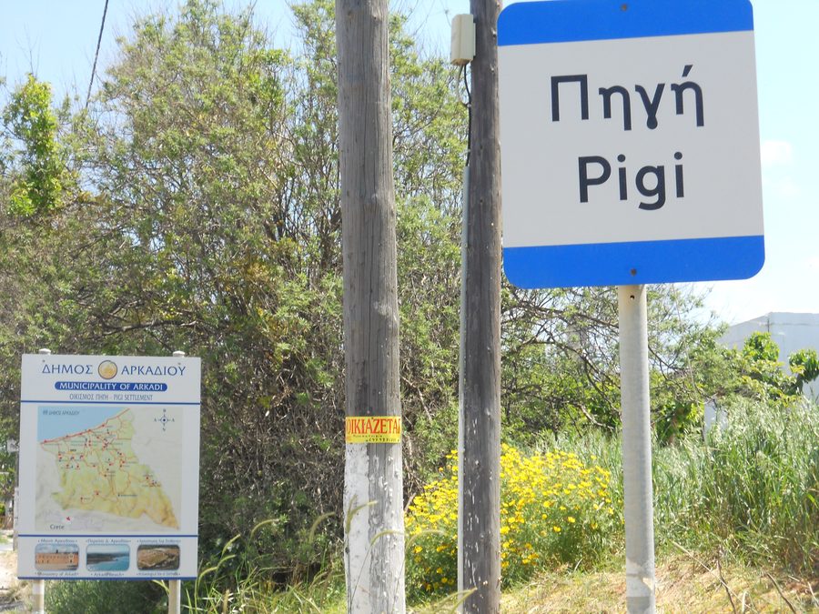 Sign of Pigi and map of Arkadi municipality at the entrance to the settlement of Pigi in Rethymno