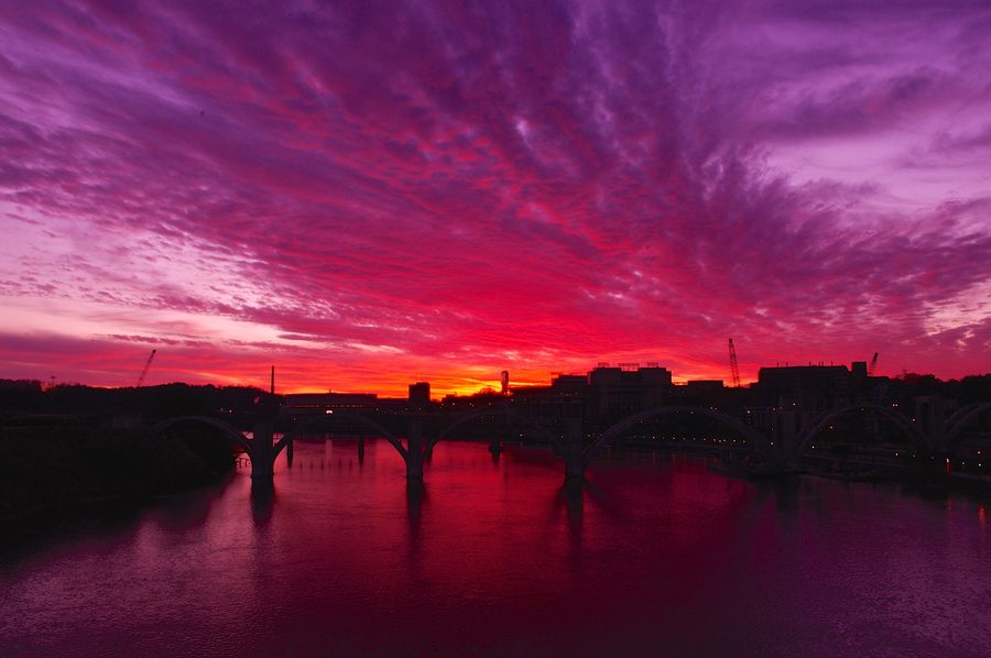 View from Gay Street Bridge toward the Tennessee River, bridges, and the Knoxville skyline at sunset