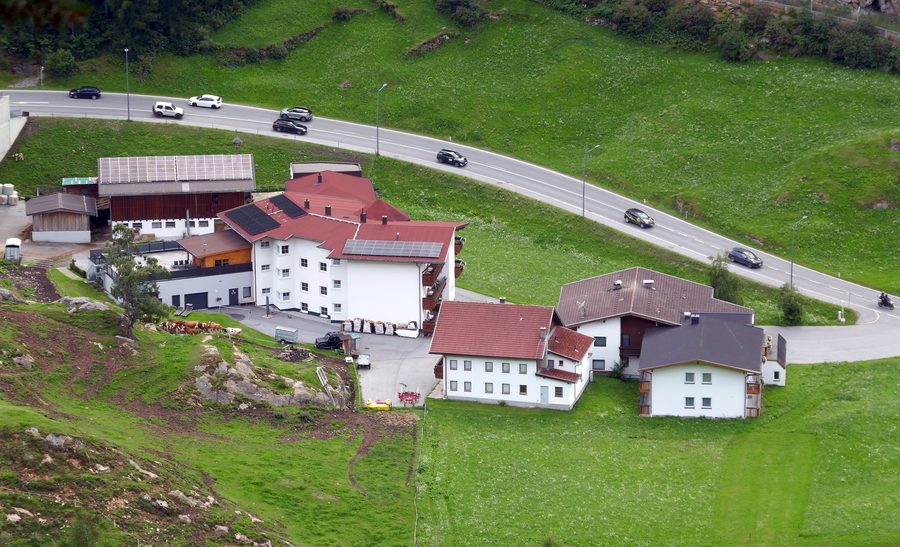Buildings on Ebeneweg in Sölden with the village street in the background