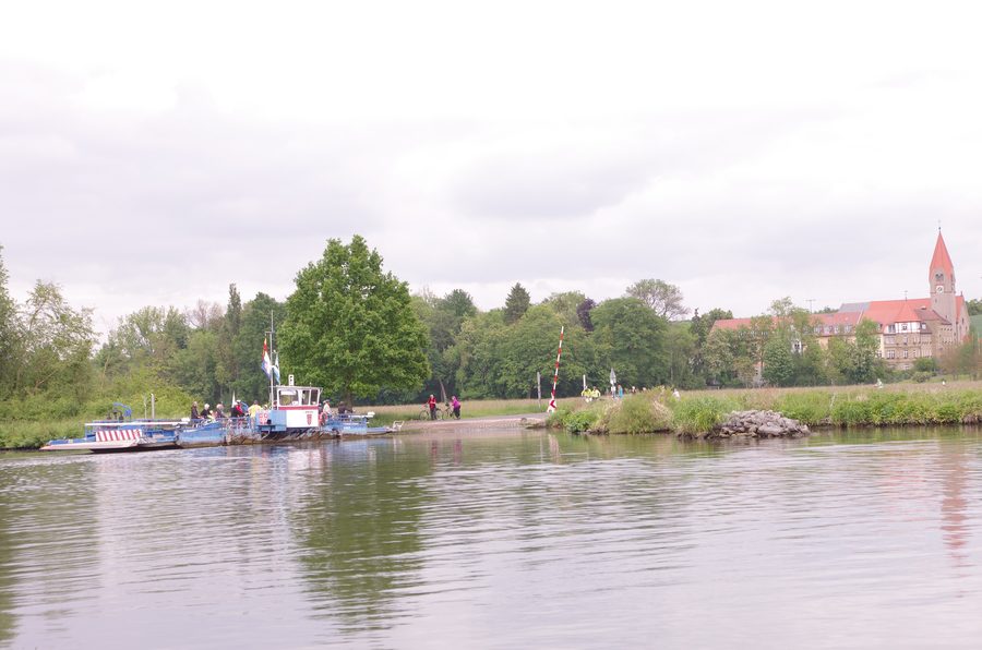 Main ferry near Wipfeld on the Main River with St. Ludwig Monastery in the background