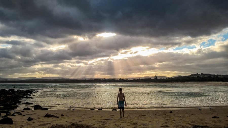 Merimbula Bar Beach on the coast of New South Wales under cloudy skies