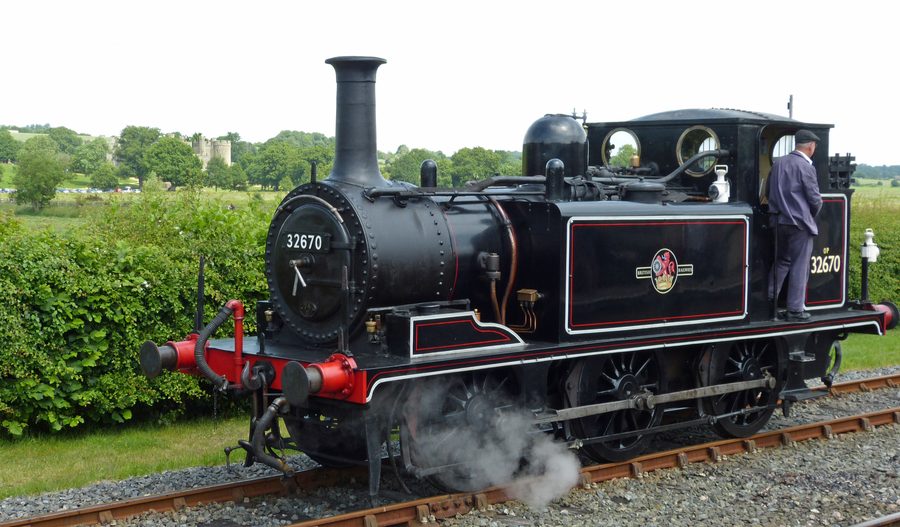Steam locomotive at Bodiam with Bodiam Castle in the background