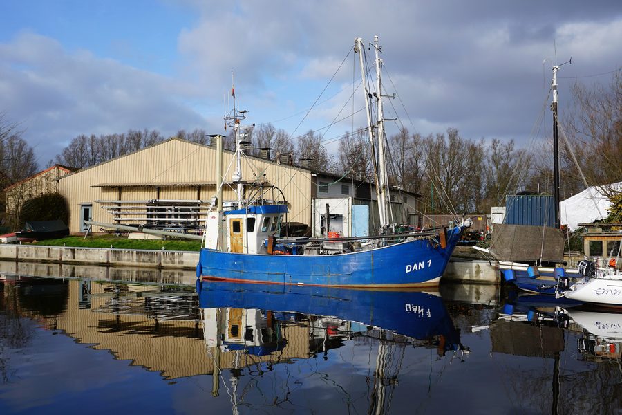In the harbor of Varel, the crab fishing boat DAN 1 Friesland lies ashore in winter.