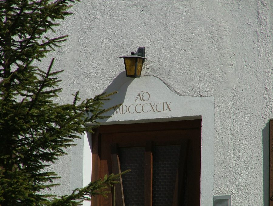 Parish house in Unterjoch, Bad Hindelang, against an alpine landscape