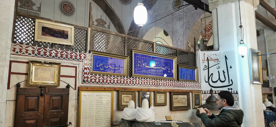 Exterior view of the Mevlana Museum in Konya with the green mausoleum