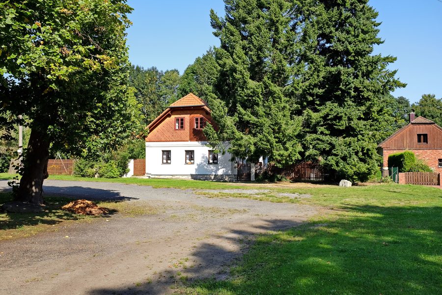 Village houses on the village square of Mnichov in the Domažlice District